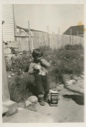 Image of Eskimo [Inuk] boy - student at MacMillan School, with Hershey cocoa